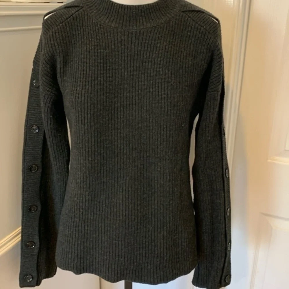 Zara sweater with cutout button detailing on sleeves